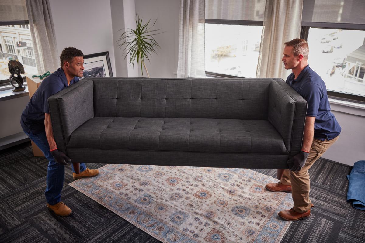 Carefully moving an office couch